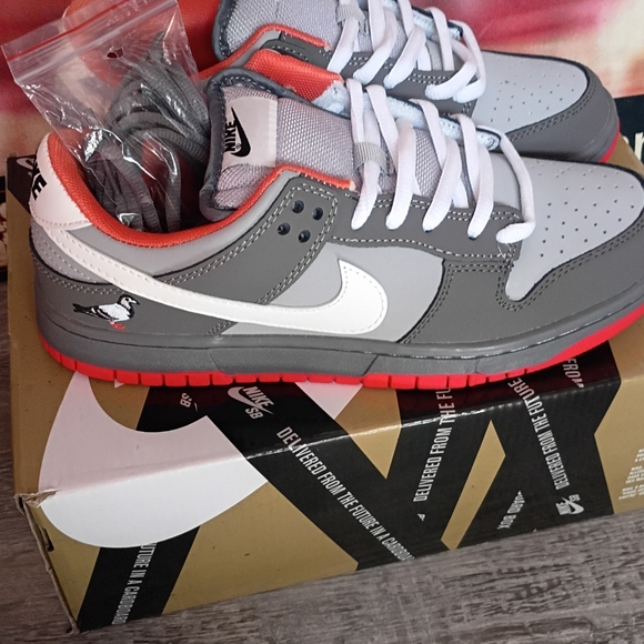 Nike Gray and White Sneakers with Red Accents